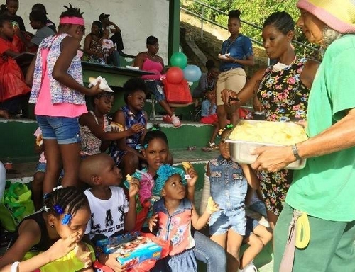 Tableland Pineapple Farmers Association and the TTFNC at the Laventille West constituency Christmas treat. (Photo from Trinidad Express)